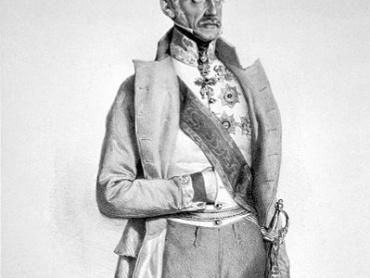 Polní podmaršálek (od 17. 10. 1848 polní maršálek) Alfred kníže zu Windischgrätz (1787– 1862) s Řádem zlatého rouna, velkostuhou a hvězdou Vojenského řádu Marie Terezie, hvězdou Královského uherského řádu sv. Štěpána, služebním křížem za roky odsloužené v armádě a zlatým dělovým křížem z napoleonských válek. Byl dále nositelem ruského Imperátorského řádu sv. Alexandra Něvského, ruského Imperátorského řádu sv. Vladimíra, ruského Imperátorského řádu sv. Jiří, pruského Řádu červené orlice, hannoverského Řádu Guelfů, savojského řádu sv. Mauricia a sv. Lazara a bavorského Řádu sv. Huberta. Litografie Josefa Kriehubera z roku 1848.